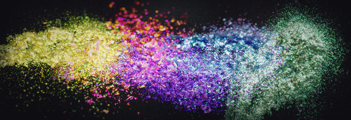 Loose cosmetic pigment scattered on black