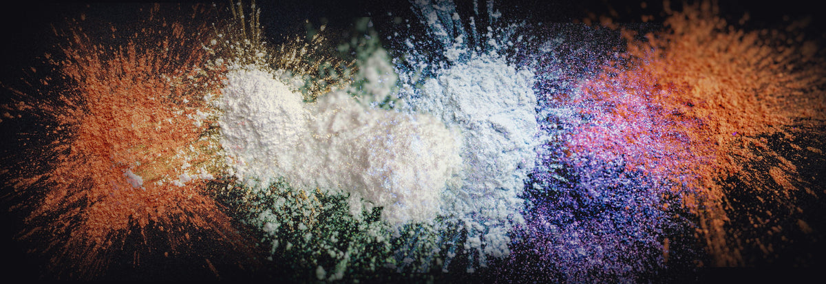 Loose cosmetic pigment scattered on black